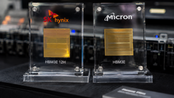 SK Hynix and Micron HBM3E memory chips displayed side by side at a technology showcase.