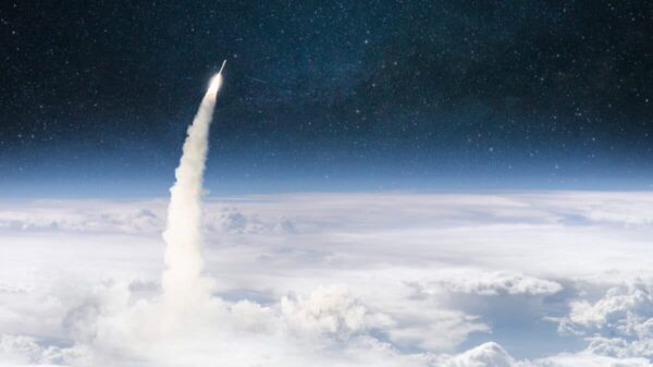 Rocket lift off through the clouds