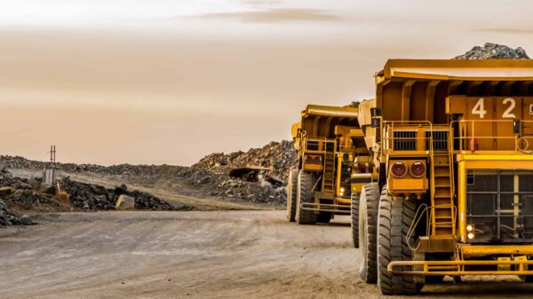 Super sized rock trucks take a load of platinum rich rock into the crusher.