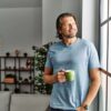 Middle aged man drinks coffee